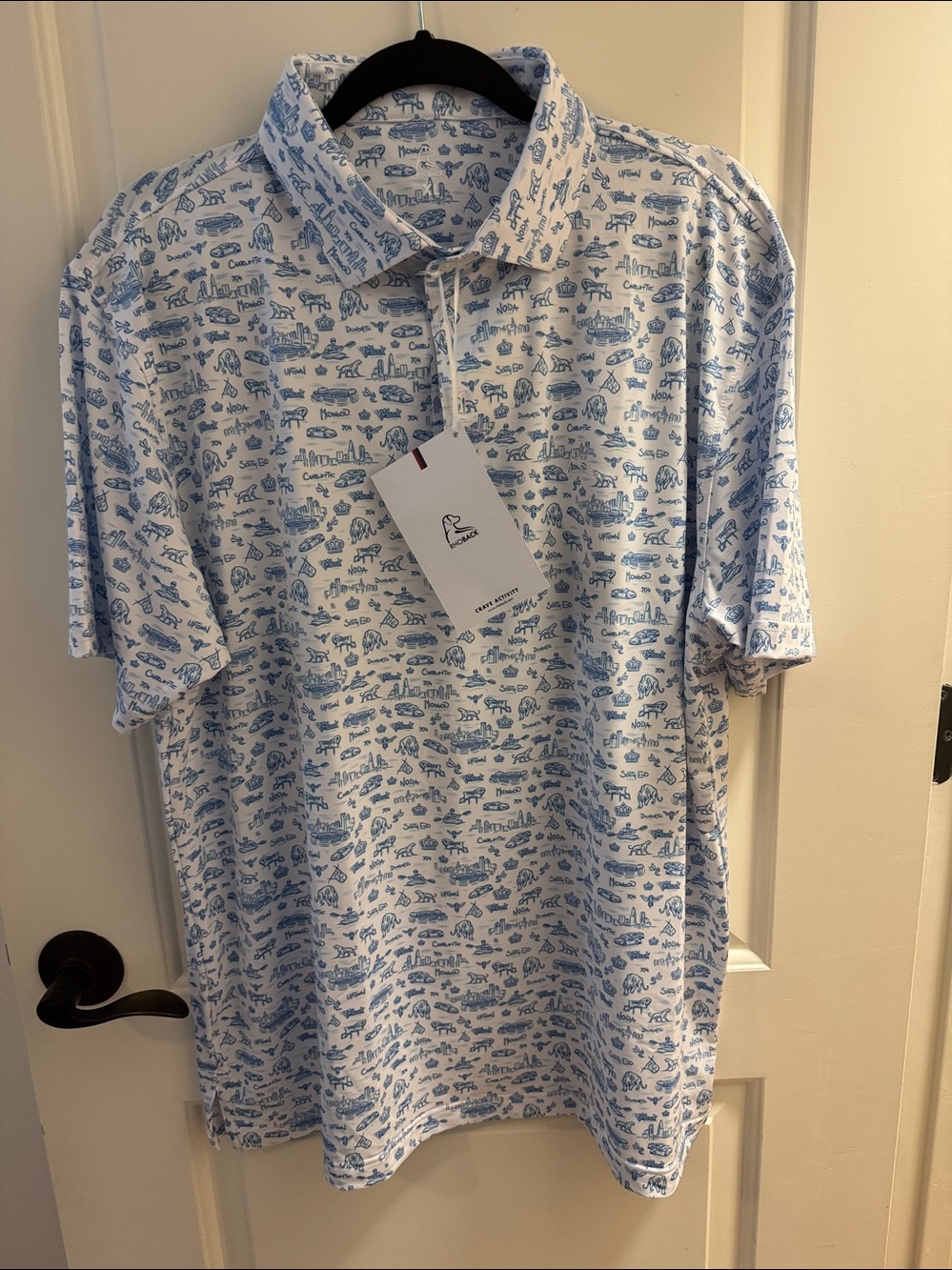 Rhoback men’s White Polo in Caicos blue & white Print, “The Mint City” Charlotte